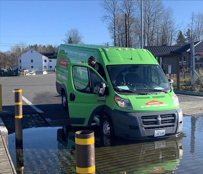 SERVPRO truck parked in puddle